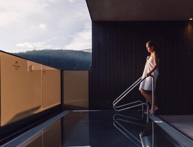 A woman goes into the plunge pool