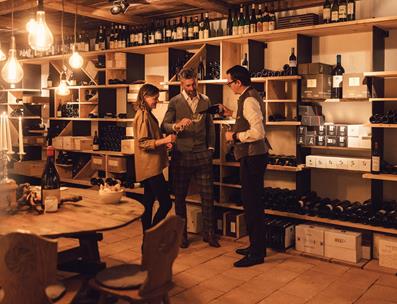 Peter and Two Guests in the Wine Cellar