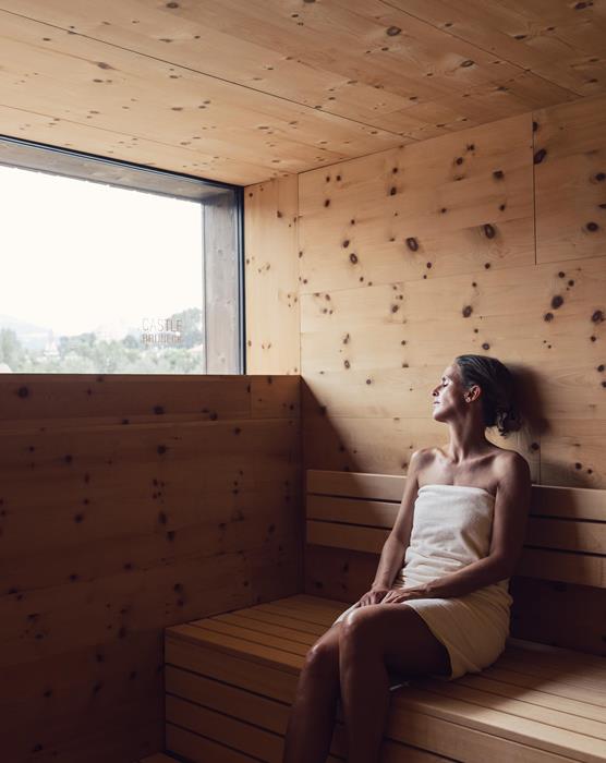 Woman relaxes in the Finnish sauna