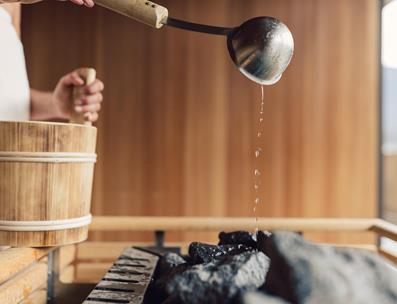 To sprinkle water on the hot stones of the sauna
