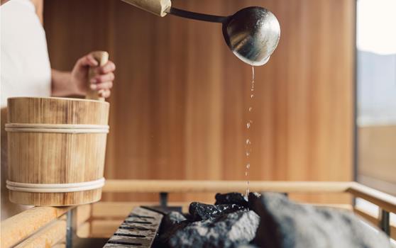 To sprinkle water on the hot stones of the sauna