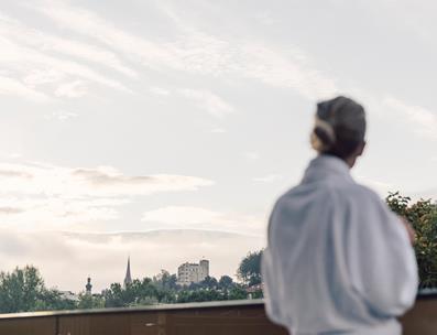 Woman enjoys the view on Bruneck Castle